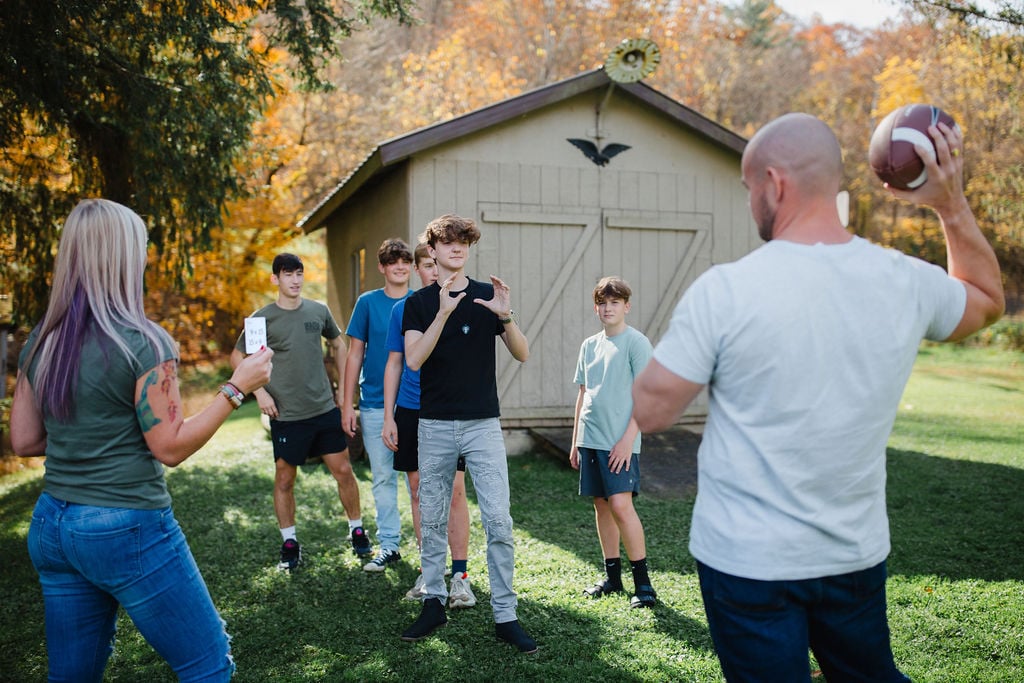 Homeschoolers play math games outside.